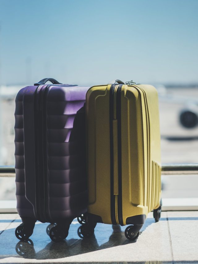 Suitcases,In,Airport,Departure,Lounge,,Airplane,In,Background,,Summer,Vacation