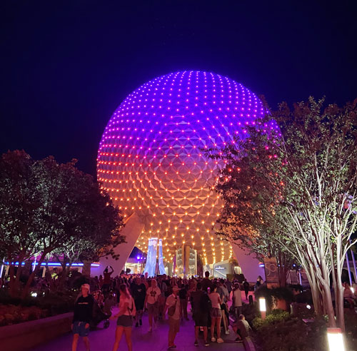The view of Spaceship Earth at EPCOT lit up at night